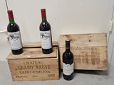 three bottles of wine sitting next to each other on a counter