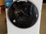 a washing machine that is sitting on the floor