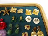 a tray that has many different types of jewelry on it
