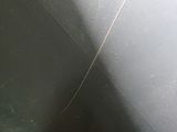a close up of a toilet with the seat up