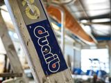 a close up of a ladder with a sign on it