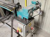 a machine that is sitting on a table in a garage
