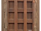 a picture of an old wooden window with a sign on it