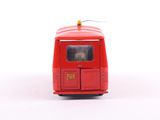 a red toy truck with a yellow light on top