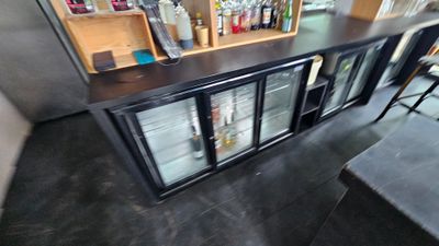 a small bar with a lot of bottles on it