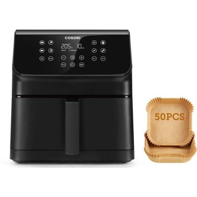 a black air fryer sitting next to a brown paper bag
