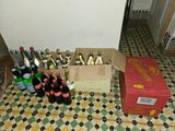 bottles and boxes of beer sit on a tiled floor in a room