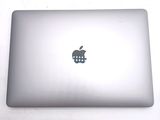 an apple logo on the back of an apple laptop