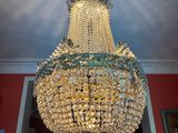 a crystal chandelier hanging from the ceiling in a room
