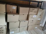 many boxes stacked on top of each other in a room