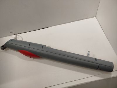 a gray and red object in a white box