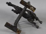 statue of a horse with a cross on it ' s back