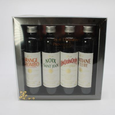 three bottles of wine in a box on a white surface