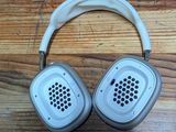 an image of a pair of headphones sitting on top of a wooden floor