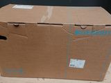a large cardboard box sitting on top of a wooden floor