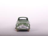a toy car that is sitting on a white surface