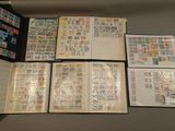 many different types of stamps on the pages of a book
