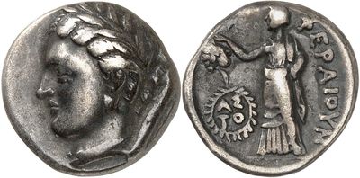 a close up of a coin with an image of a woman on it
