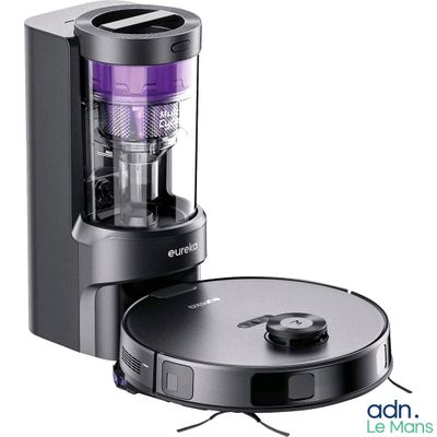 an image of a black and silver vacuum cleaner with a purple light on it