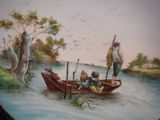 a plate with a painting of a man and two children in a boat