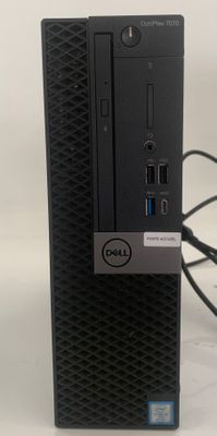 the dell desktop computer is sitting on top of a white surface