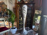 a vase sitting on top of a table in a living room