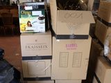 many boxes stacked on top of each other in a room