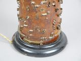 a small vase that has a lot of spikes on it