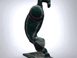 a statue of a bird that is sitting on top of a table
