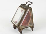 a small glass box with a picture inside of it