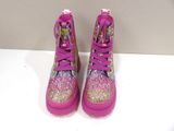 pink and gold glitter high top sneakers with bows and bows on them
