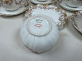 a lot of tea cups and saucers on the table