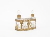 an image of a glass candle holder with two candles on top of it