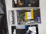 two bags of fishing lures and a pair of fish hooks
