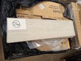 a box of wood sitting on top of a pile of other boxes