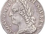 gros plan d'une pièce de monnaie sur laquelle figure une tête de femme