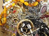 a pile of assorted jewelry sitting on a table