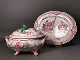 pair of pink and white porcelain dishes and covers with flowers on them
