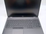 an open laptop computer sitting on top of a white table