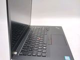 a laptop computer that is open on a white surface