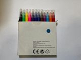 a box of pens that are sitting on a table