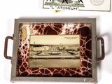 a tray with a picture of a ferris wheel and postcards on it