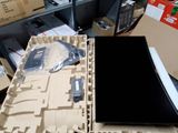 a laptop computer sitting on top of a cardboard box