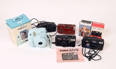 a camera and other items that are on the table