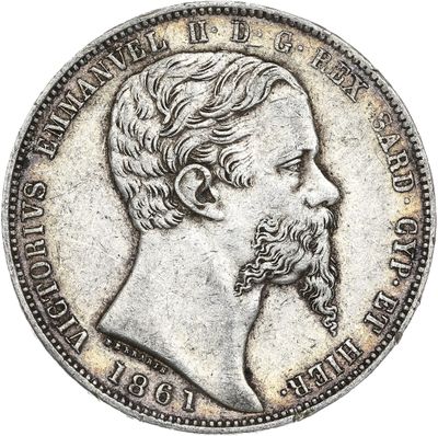 une pièce d'argent représentant le visage d'un homme barbu