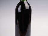 a bottle of wine that is sitting on a table