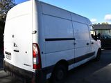 a white van that is parked in a parking lot