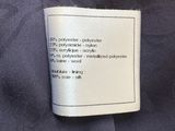 a close up of a label on the back of a jacket