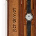 an image of a wooden box with a watch inside of it