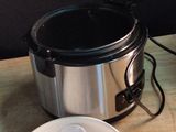 a bowl of soup and a pot of soup sitting on a table